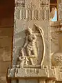 India, Bala Krishna Temple at Hampi. Woman with bow, an attendant removing a thorn from her foot. Early 16th century C.E.