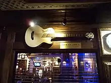 A golden guitar on the wall