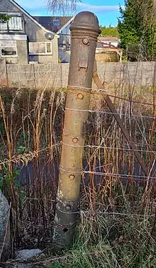 A wire fence strainer on the Deeside line near Peterculter made by Harper and Co, Ironfounders, Aberdeen.