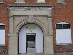 Haskelite building, East  "Change Parts" above door