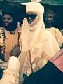 A teenage Hausa boy wearing traditional cloths