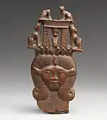 Head of Hathor from a clapper; 1295–664 BC; possibly boxwood; 12 × 6.2 cm; Metropolitan Museum of Art