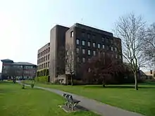 a six-storey building with a dark-brown brick veneer.