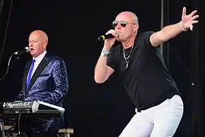 Heaven 17 performing live in Liverpool in July 2021Left to right: Martyn Ware (keyboards), Glenn Gregory (vocals)