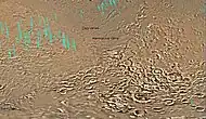 Map of the eastern part of Hellas Planitia (a vast impact crater), showing two large river valleys that slope left, toward the floor of the crater.