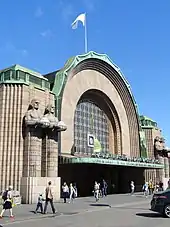 The Lyhdynkantajat ("Lantern Carriers") sculptures on the front of the Helsinki Central Station, 1914