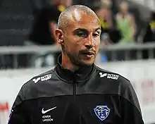 Henrik Larsson, wearing a tracksuit top, taking training