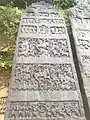 Seven panel Hero Stone from 1152 CE Old with Old Kannada inscription from Shimoga taluk, Karnataka