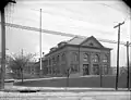 A black-and-white photo of the Herron Hill Pumping Station in 1907. Compared to the 2019 photo, it looks very similar except that is has glass windows.