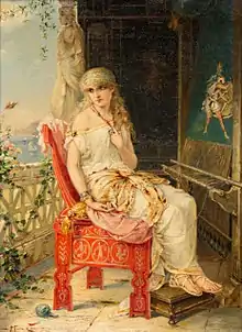 A woman sitting on a chair on a balcony