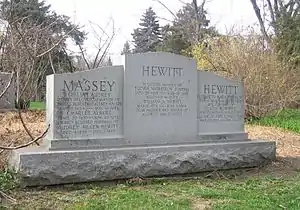 Large grey granite monument with three sections engraved with names of Hewitt and Massey family members