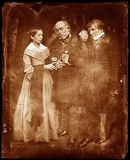 middle-aged woman and two elderly men