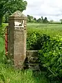 The gatepost and pedestrian steps combination at The Hill farm, Dunlop, East Ayrshire.