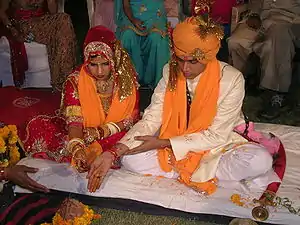 A Rajput Hindu bride and groom during their wedding ceremony.