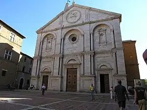 Cathedral at Pienza (c. 1460), with the  coat of arms of Pope Pius II