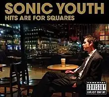 A man in a suit is seated inside a Starbucks shop listening to music through his headphones. The photo is set at night with the city lights illuminating from the background. Sonic Youth and Hits Are for Square are written in capitalized tan text at the top of the cover.