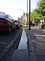 Hobson's Conduit running in a sluice along the street towards Peterhouse.