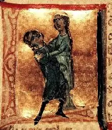 A lady holding a man in her arms