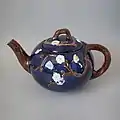 Coloured glazes Floral Teapot and cover c 1880.