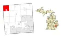 Location within Oakland County (red) and the administered village of Holly (pink)