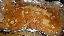  A butter cake made with cashew nuts on an air fryer, in an aluminium foil container.