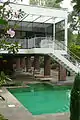 swimming pool with stairs to the balcony