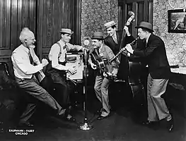 The Hoosier Hot Shots with Uncle Ezra (announcer Pat Barnett at left) publicity photo for the National Barn Dance, 1935