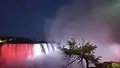 A view of Horseshoe Falls with the Canadian flag at night