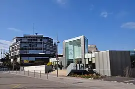 The André Malraux cultural center in the foreground and the town hall in the back.