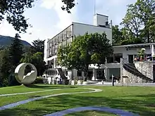 Hotel on Monte Verità, designed by architect Emil Fahrenkamp in 1927; built in Bauhaus style in 1928 Fahrenkamp furnished it with part of his East-Asian art collection. In 2008 the hotel was renovated.