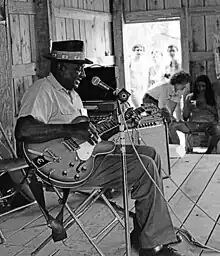 Houston Stackhouse performing with his guitar at the 1976 Smithsonian Festival of American Folklife, Washington, DC. Photo by Jeff Titon