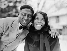 Lead Belly, on the left, with his arm around and Martha
