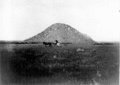 Huerfano Butte from the east in 1902. Notice the grassland, which has since turned into a desert of mesquite, prickly pear and cholla.