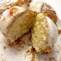 Hungarian túrógombóc, made with semolina flour and túró (curd cheese), rolled in breadcrumbs, and served with sour cream and sugar