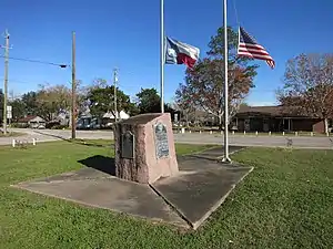 Granite rock displays four historical markers