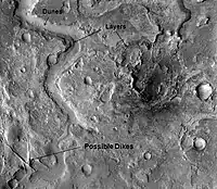 Huo Hsing Vallis in Syrtis Major, as seen by THEMIS.  Straight ridges may be dikes in which liquid rock once flowed.