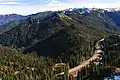 Looking southeast at peaks on Hurricane Ridge including Steeple Rock, Eagle Point, Obstruction Peak, Elk Mountain, and Maiden Peak.