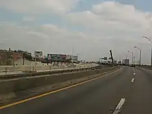 Driver's view of a four-lane divided highway under construction