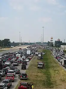 Photograph of stranded and evacuating vehicles along a highway