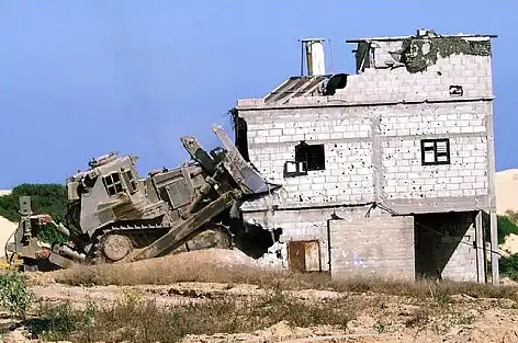 IDF Caterpillar D9L razing a Palestinian house