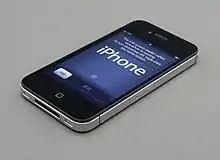 An iPhone 4S, a slate phone from 2011