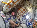 Korniyenko (right), Padalka (center) and Kelly (left) inside the spacecraft prior to the relocation maneuver.