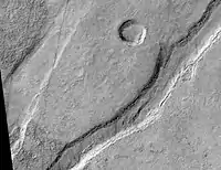 Icaria Fossae Graben, as seen by HiRISE.  Click on image for a better view of Dust Devil Tracks.