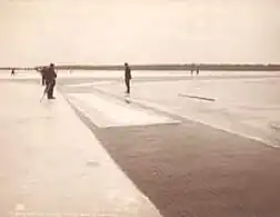 Men harvest ice on Michigan's Lake Saint Clair, circa 1905. The ice was cut into blocks and hauled by wagon to a cold storage warehouse, and held until needed