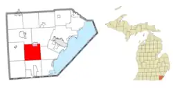 Left: Location within Monroe County (red) and an administered portion of the CDP of Ida (pink); Right: Location in the state of Michigan