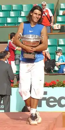 Image 57Rafael Nadal holding the Coupe des Mousquetaires in 2006. (from French Open)