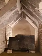 Burial chamber and sarcophagus in the foreground