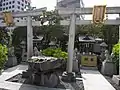 Two small Inari shrine with two foxes guarding each fronts