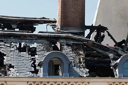 A portion of the damaged roof on the east side of the court