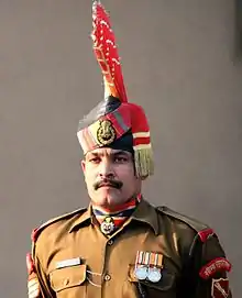 Sentry from the Indian Border Security Force, wearing a striped ascot